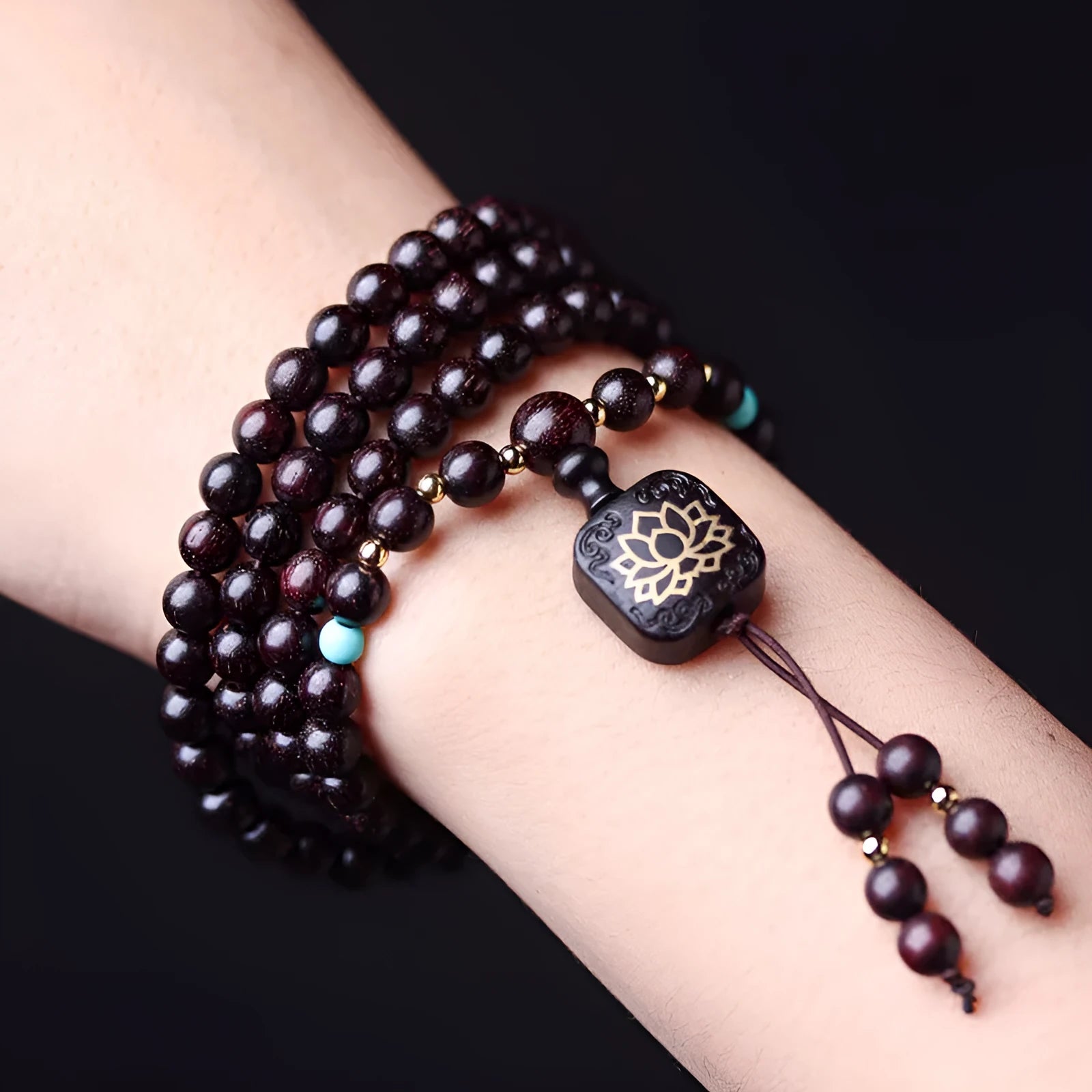 Zambia rosewood DIY bead bracelet with flat lotus pendant ornament on wooden surface
