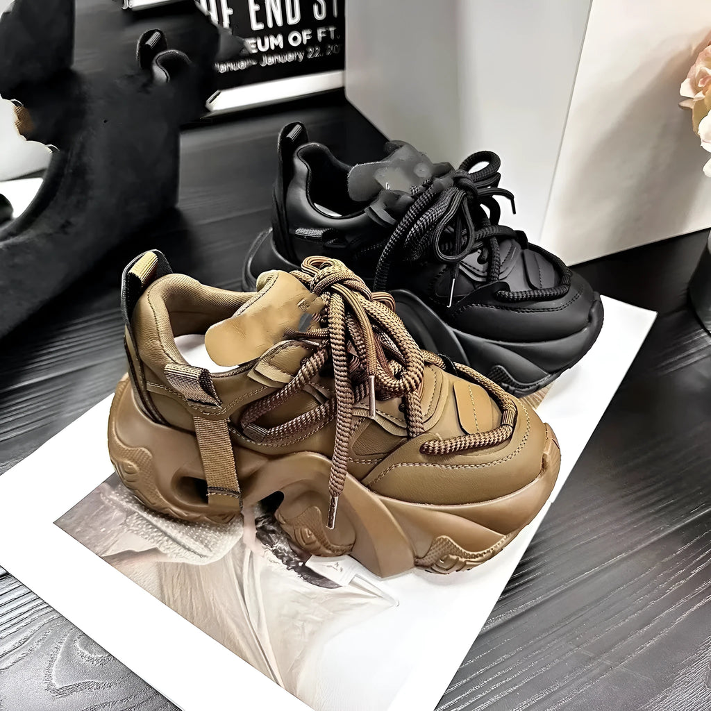 Women's low-top sneakers with wedge heel platform, cross-strap detail on synthetic leather upper, in creamy white colour.