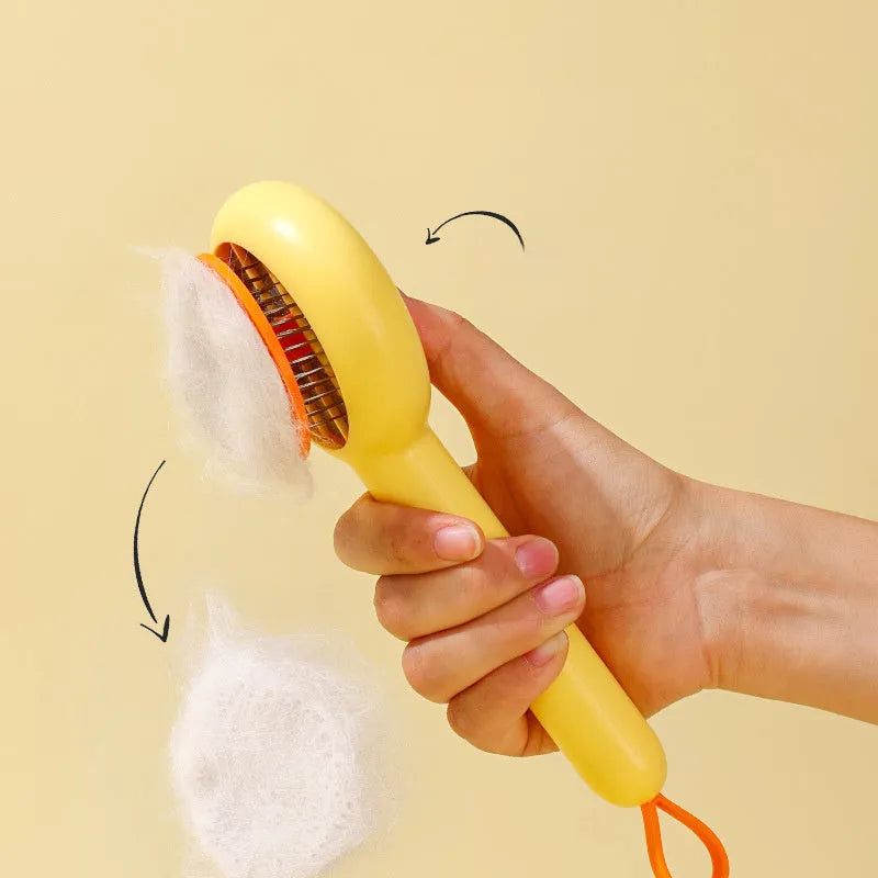 Small yellow duck-shaped pet grooming comb with needle teeth for cats and dogs