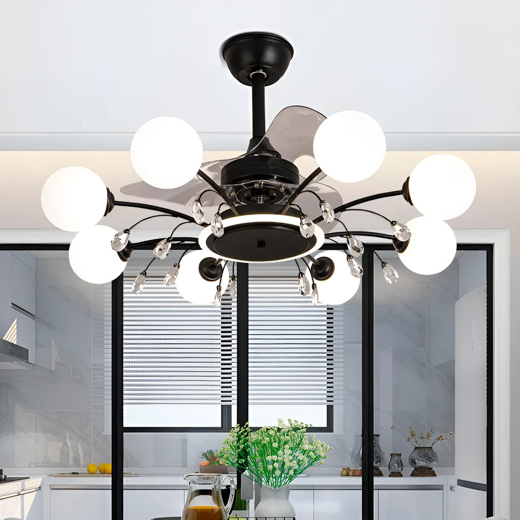 Gold and black ceiling fan lamp with acrylic shade and metal blades, showing remote control