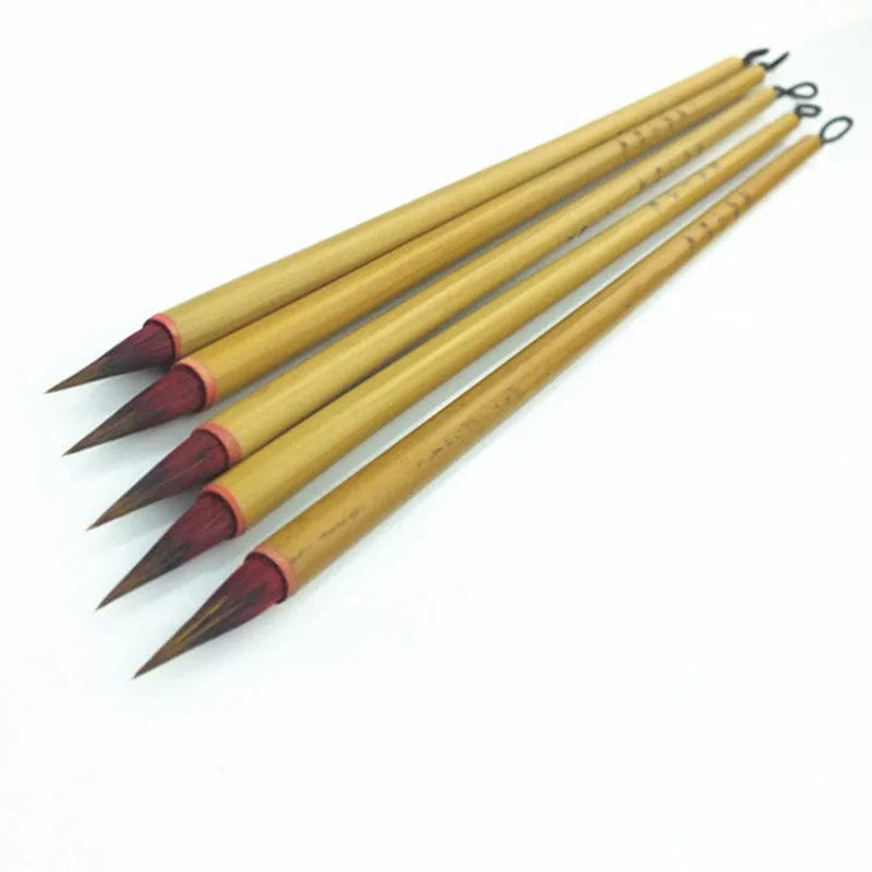 Small red writing brush with mixed sheep and wolf hair bristles on wooden handle