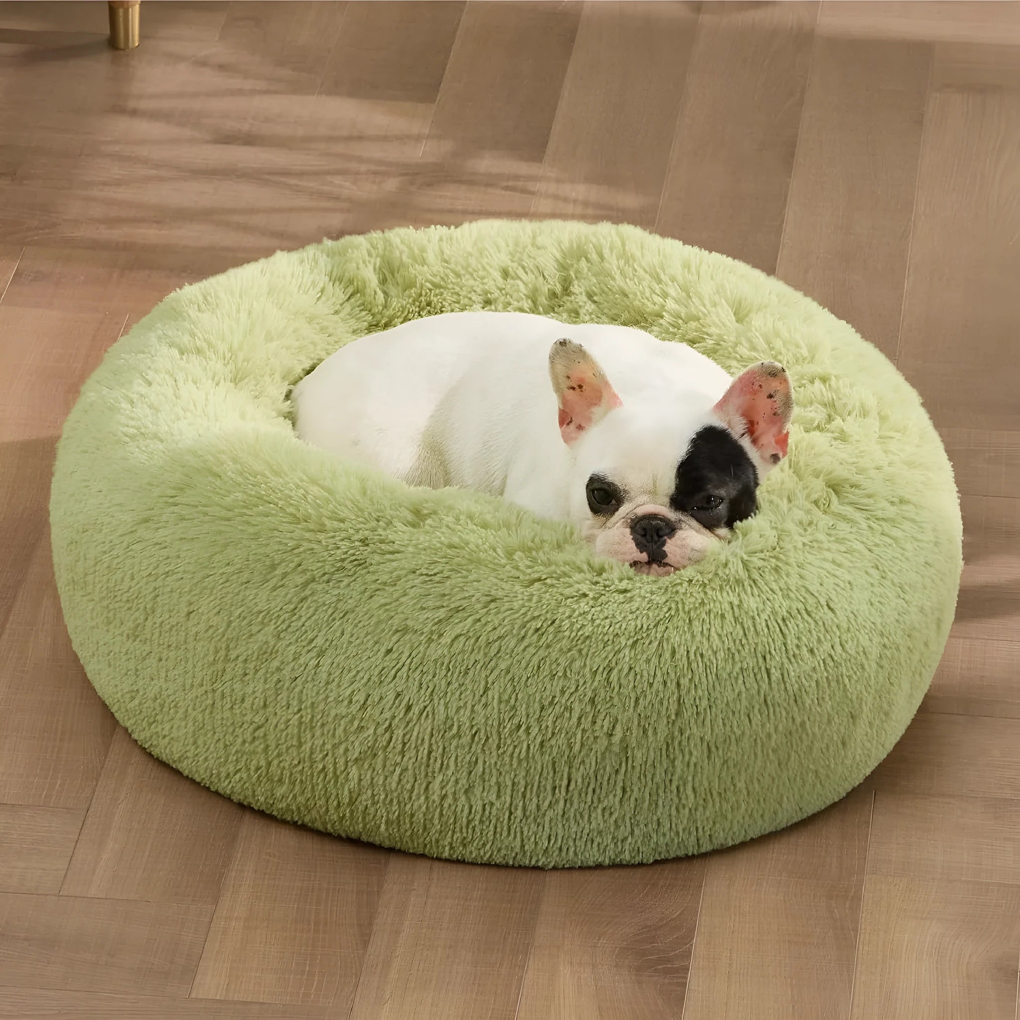 Indoor non-slip round fluffy plush pet bed for dogs in khaki, 60cm size, on a wooden floor