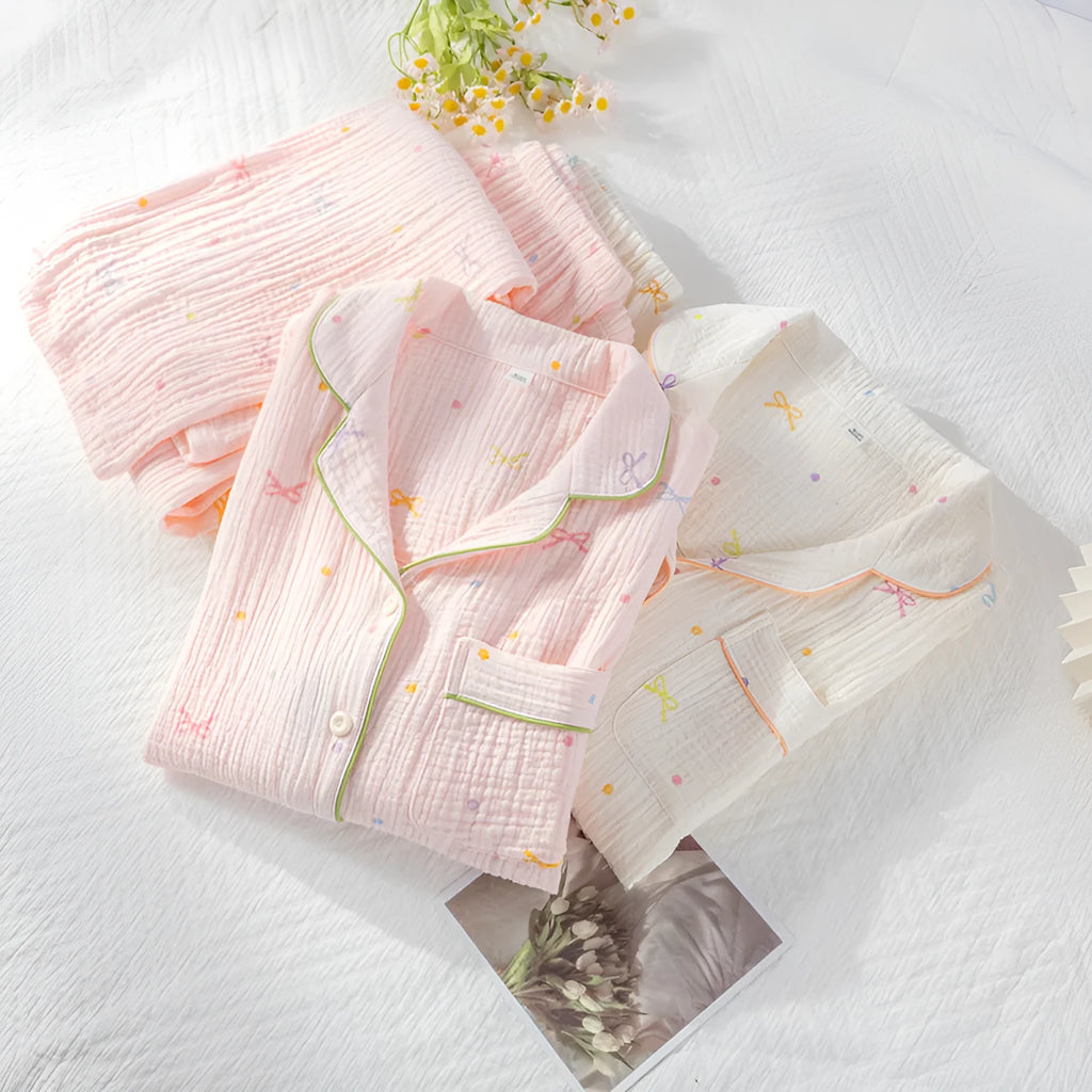 Women's lightweight cotton crepe pyjama set in pink, showing long sleeves and trouser legs.