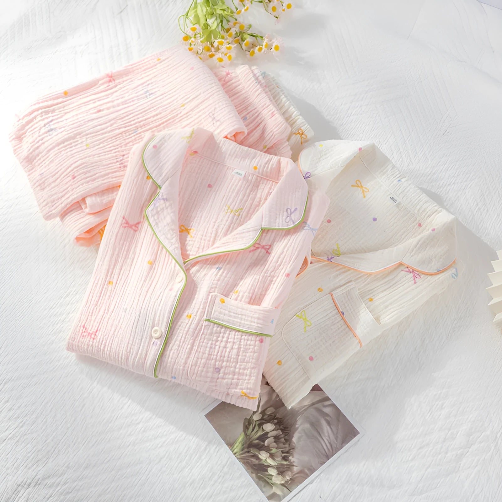 Women's lightweight cotton crepe pyjama set in pink, showing long sleeves and trouser legs.