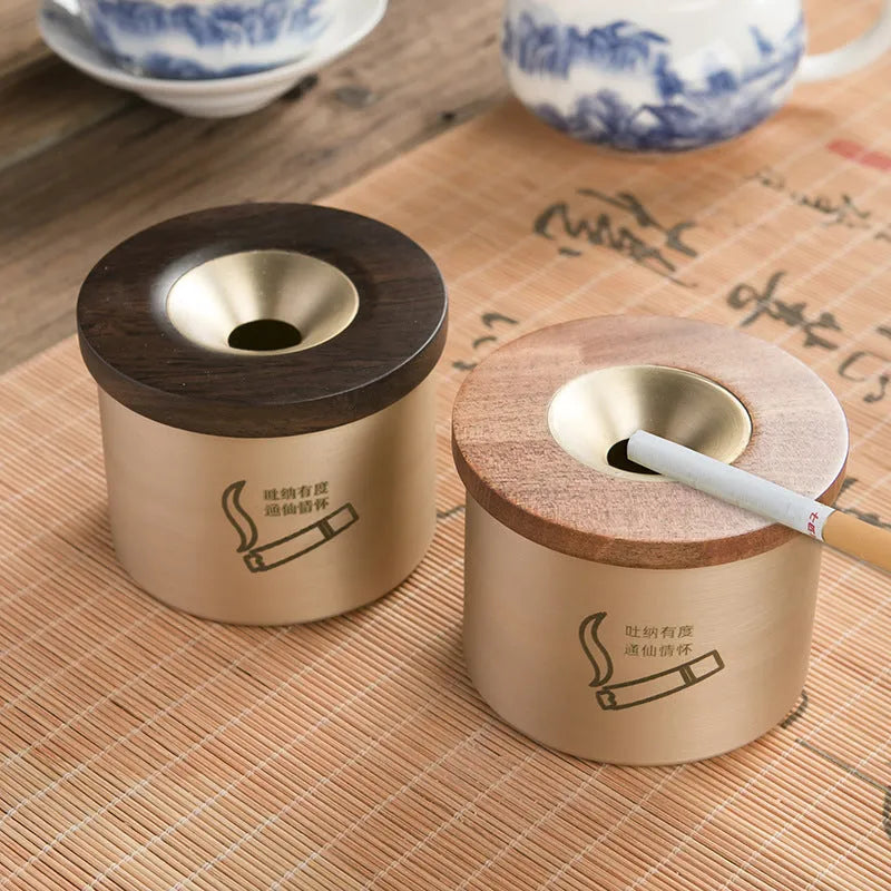 Brass ashtray with wooden lid in retro design for living room decor