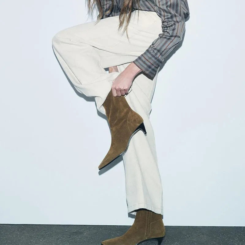 Brown women's square toe ankle boots with a side zipper and a mid stiletto heel on a waterproof platform sole.