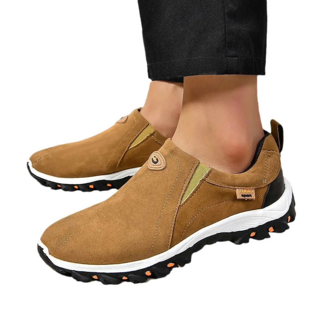 Men's black elastic slip-on shoe covers with round toe and rubber sole, showing PU upper material.