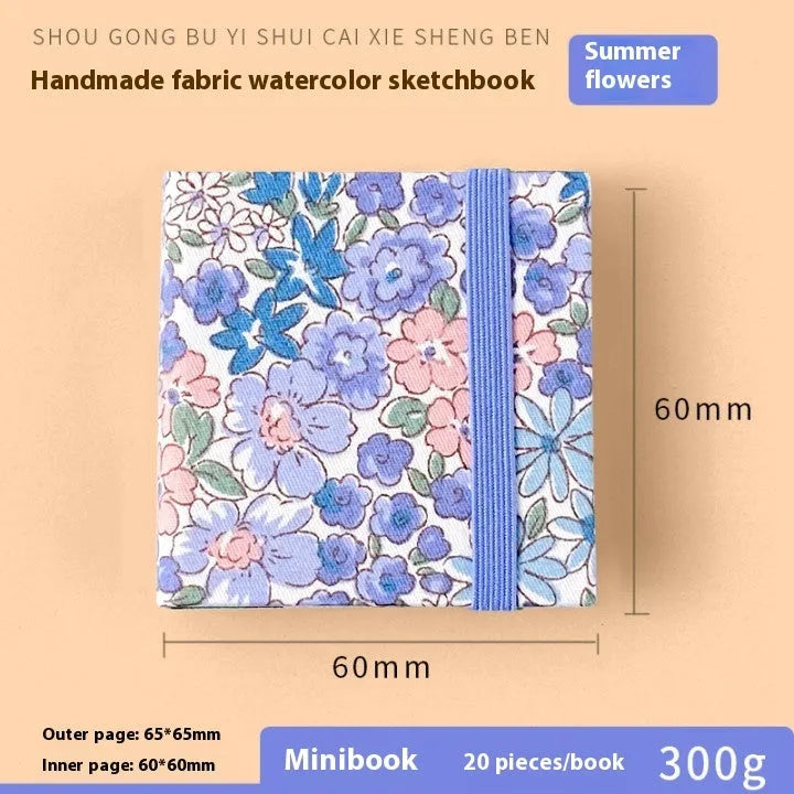 Feiluniao handmade fabric watercolour notebook in 185mm portable size, showing artistic cover design.