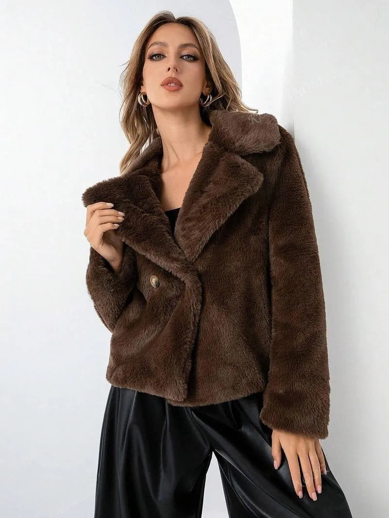 Women's artificial fur coat in rose red colour with regular sleeves on a hanger.