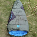 Mummy sleeping bag compressed in storage bag with colour options including army green, brown, red, and yellow