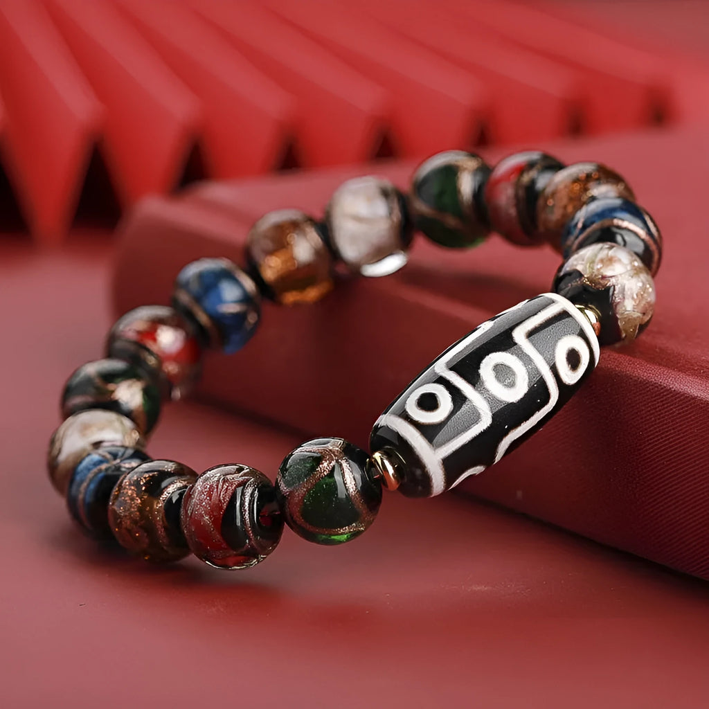 Chinese-style coloured glaze lucky bead bracelet with auspicious patterns for the Year of the Snake.