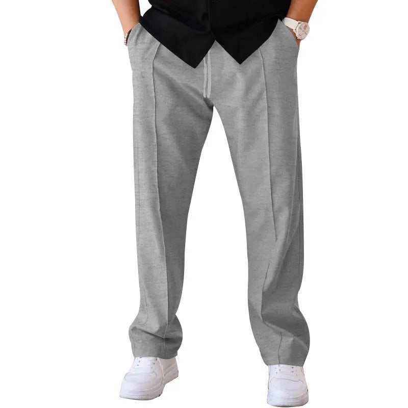 Men's loose straight drawstring trousers in waffle polyester fabric, shown in multiple colour options