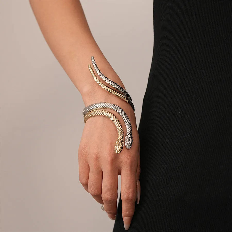 Gold exaggerated twisted snake ring and bracelet jewellery set on display