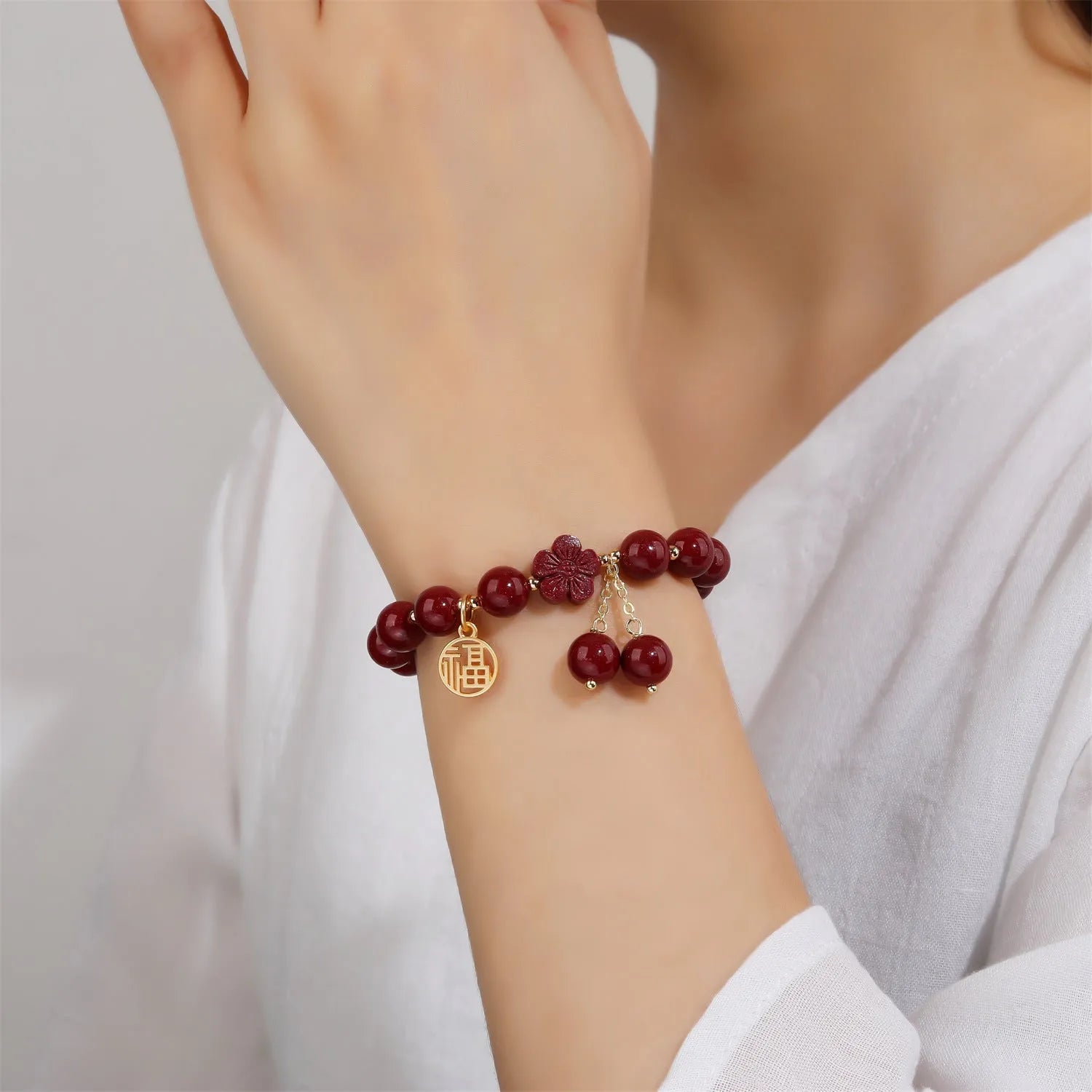 Women's cinnabar national style bracelet with purple gold sand finish and Fu character peach blossom charm