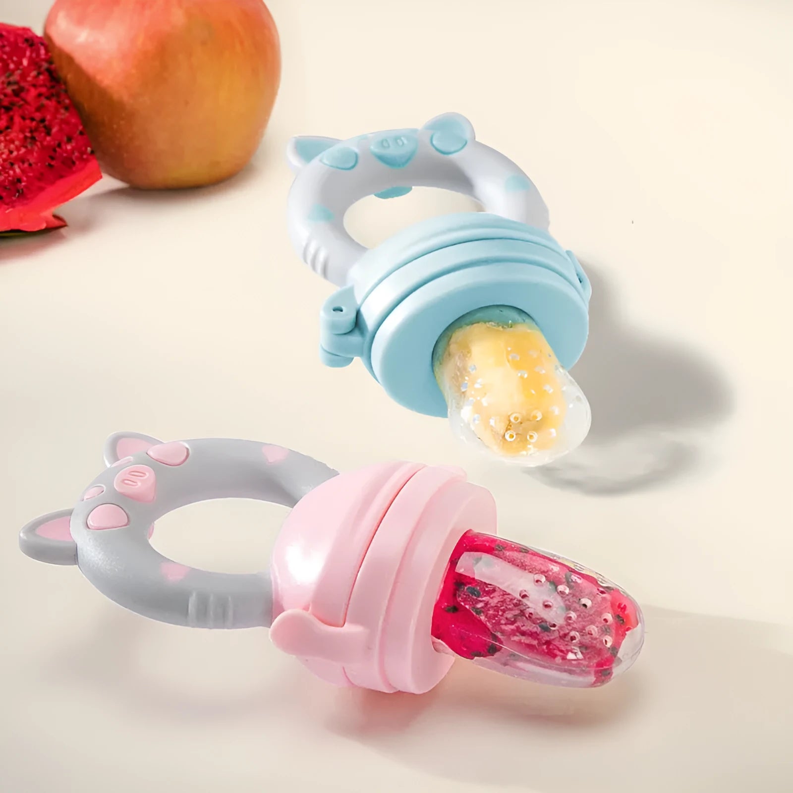 Silicone baby teether chew toy in blue, green, and pink colours showing textured surfaces