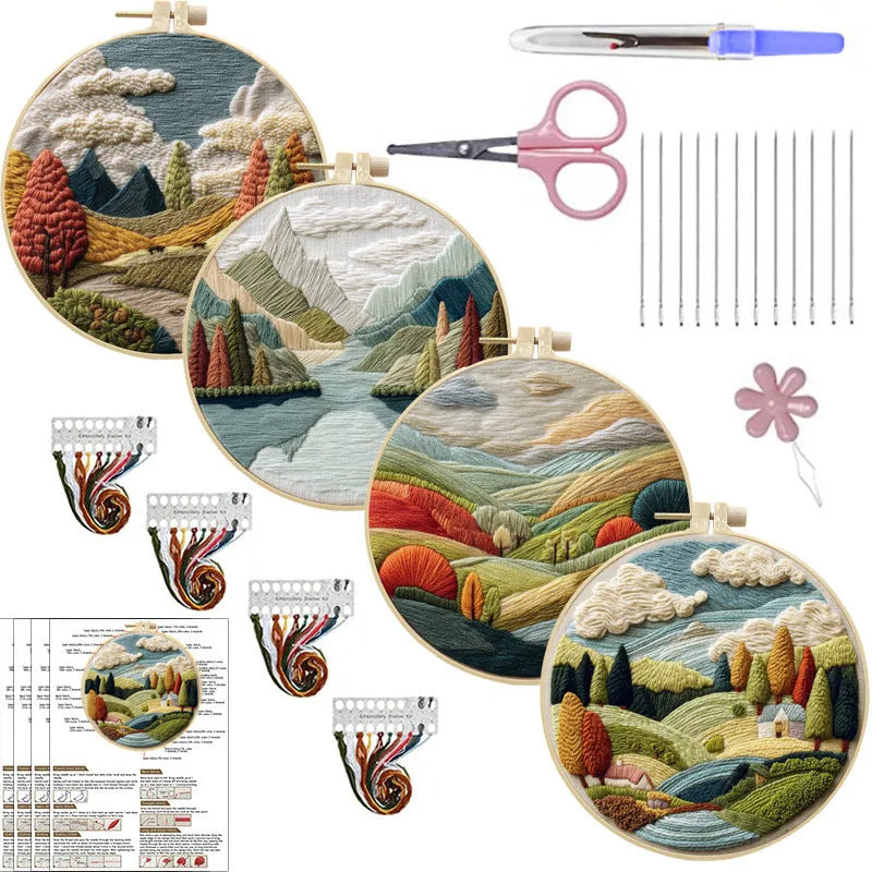 Embroidery DIY kit with bamboo frame, cotton fabric printed with a landscape scene, threads, and needles laid out