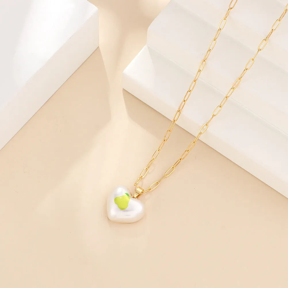 Fruit charm necklace with adjustable chain showing strawberry, pineapple, apple, pear and cherry pendant options