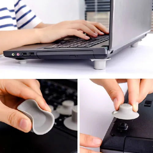 Set of four grey durable plastic laptop cooling pads: two large and two small, on a desk.