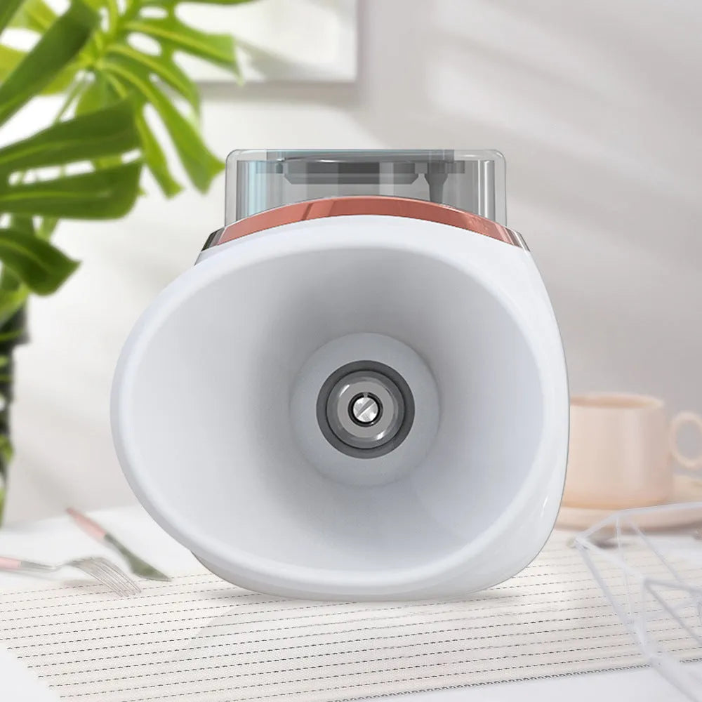 White and purple household eye humidifier with USB charging cable on wooden surface