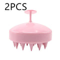 Silicone scalp massage brush with soft bristles, 9.5cm by 8cm by 7.3cm, in green