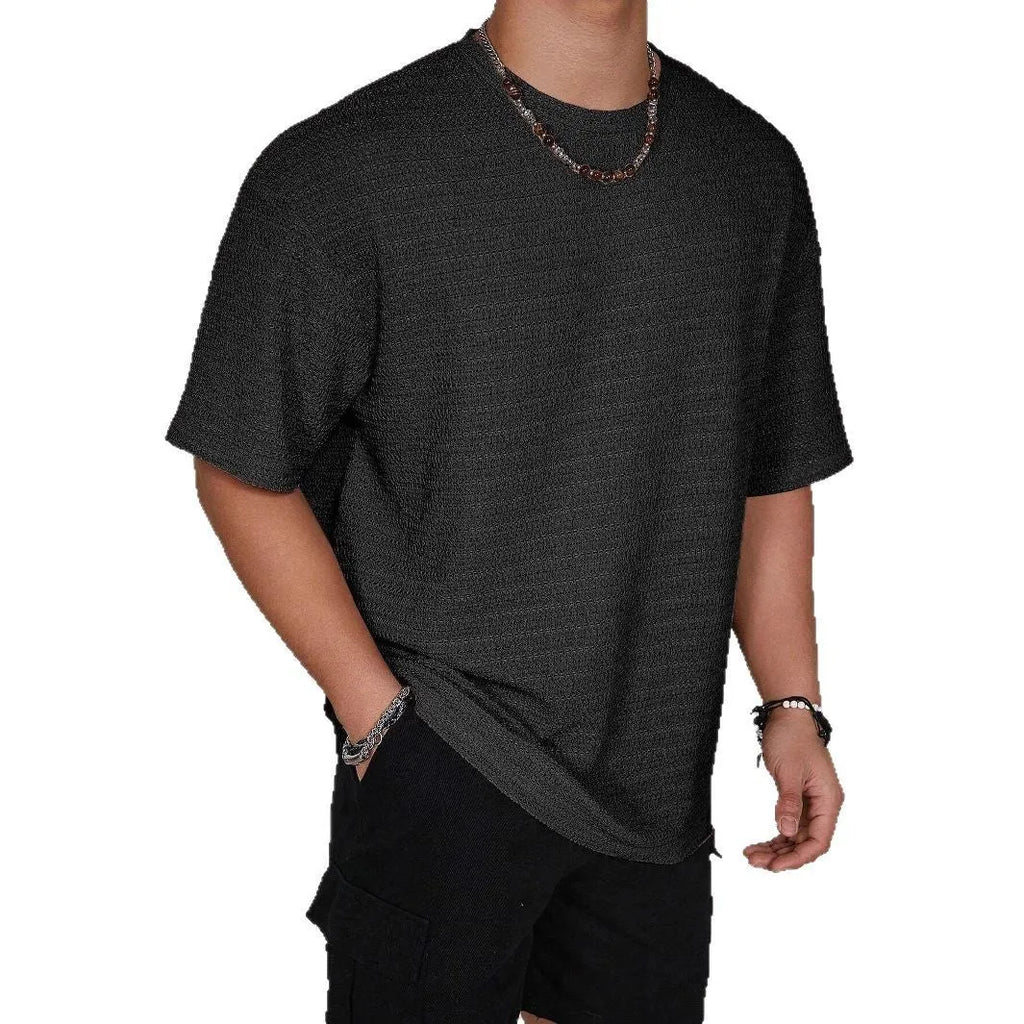 Men's slim fit solid colour T-shirt in light blue, showing round neck and short sleeves