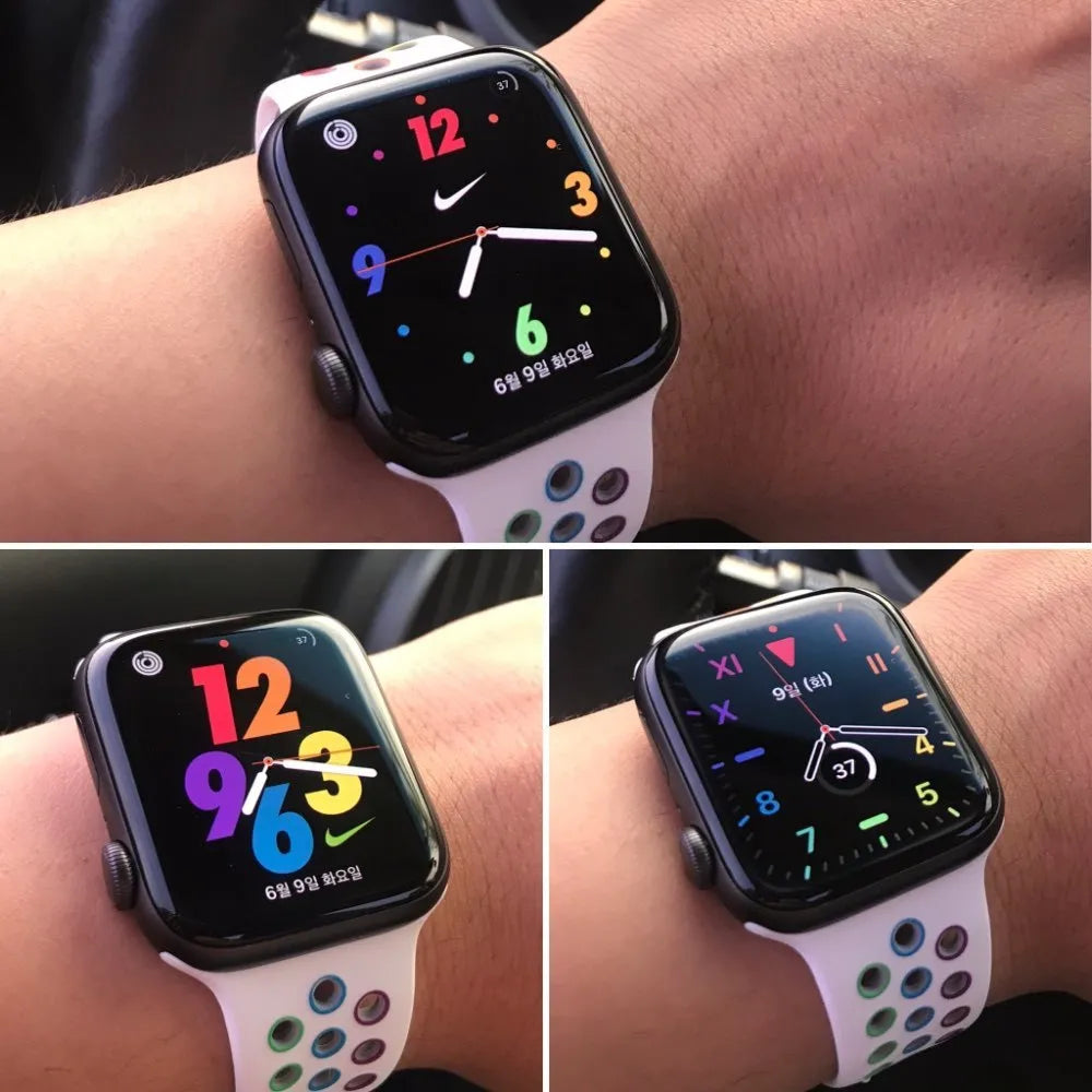 Silicone sports wristband with buckle in black, rainbow or white colour on a wrist.