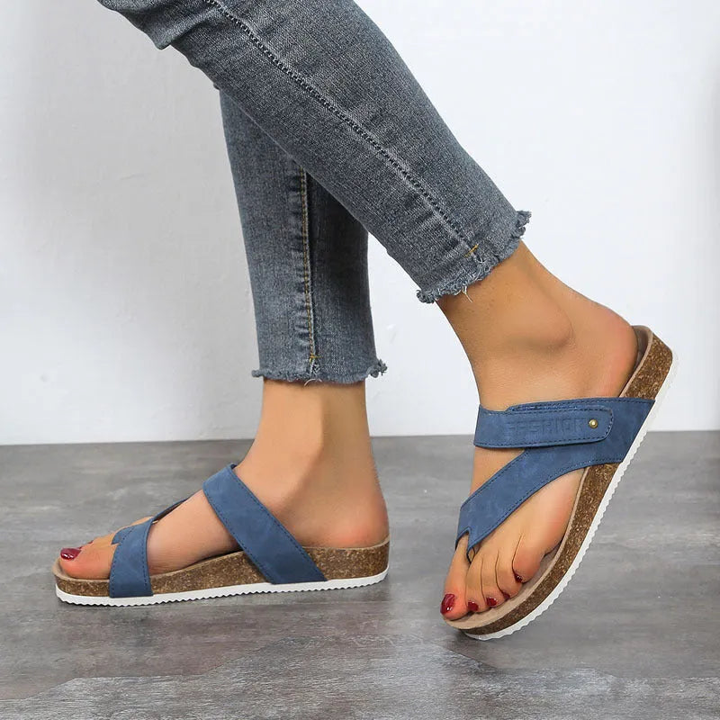 Flat toe ring flip-flops with a thick foam sole in a solid colour, shown in blue.
