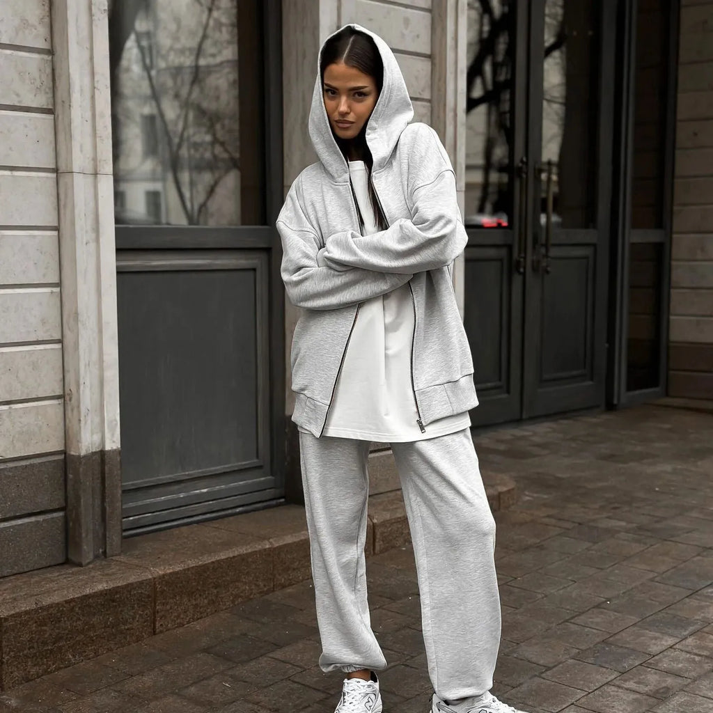 Red loose fit street style two-piece set with long sleeve coat and trousers on a rack