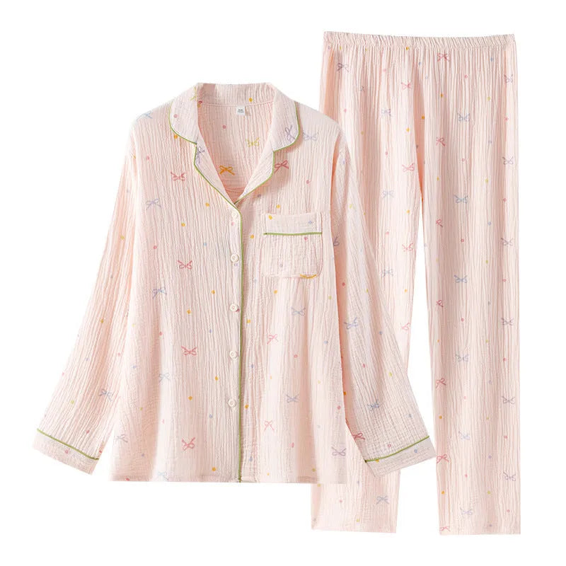 Women's lightweight cotton crepe pyjama set in pink, showing long sleeves and trouser legs.