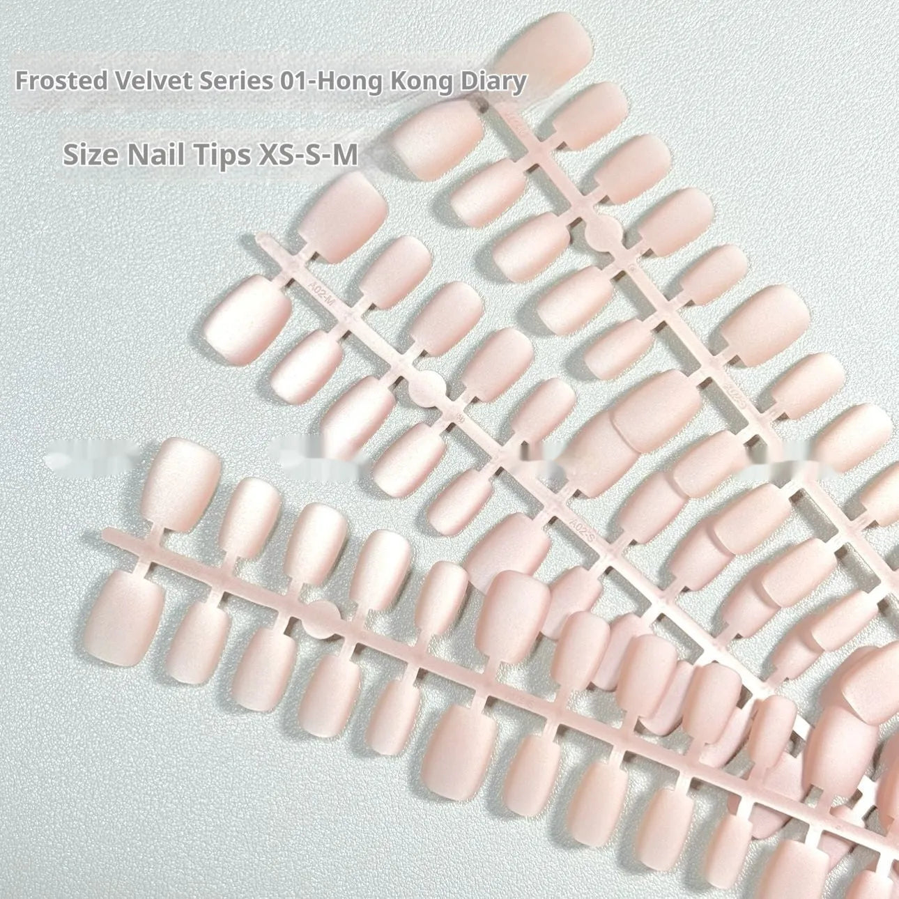 Set of frosted velvet Cat's Eye aurora effect artificial nails in short ladder sizes XS, S, and M.