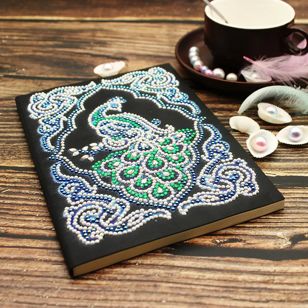Black A5 diamond painting notebook with peacock design for creative project planning