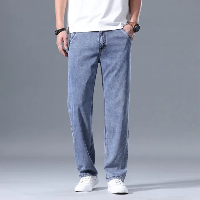 Men's loose straight-leg lyocell jeans in light blue, blue grey, smoky grey, and retro blue colours with zipper fly