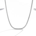 Women's sterling silver necklace with round design and diamond treatment in silver colour