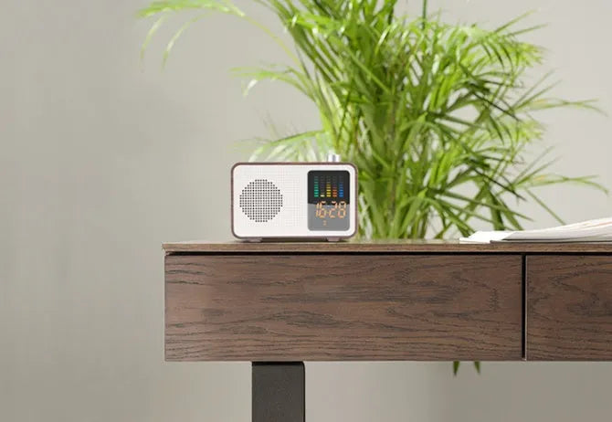 Brown wooden retro Bluetooth radio speaker with a large tuning dial on the front.