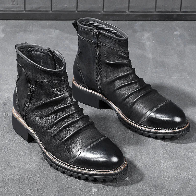 Black cowboy boots with side zip closure, embossed PU uppers, and horseshoe heel on wooden floor