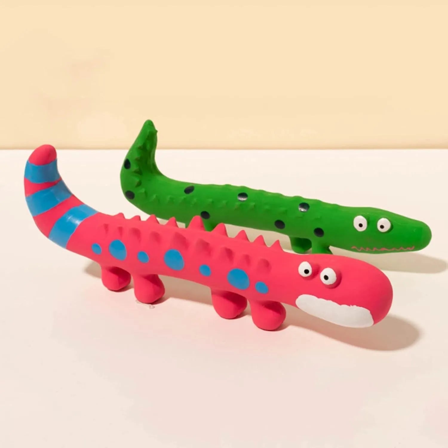 Green cartoon lizard-shaped latex dog chew toy with squeaker for aggressive chewers.