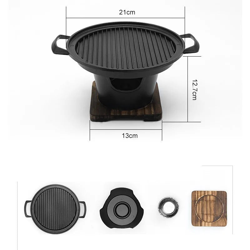 Mini BBQ grill alcohol stove with double-head flame and non-stick plate on tabletop