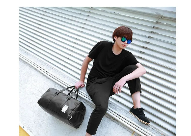 Black waterproof sports bag with separate side shoe compartments shown in large and small sizes.