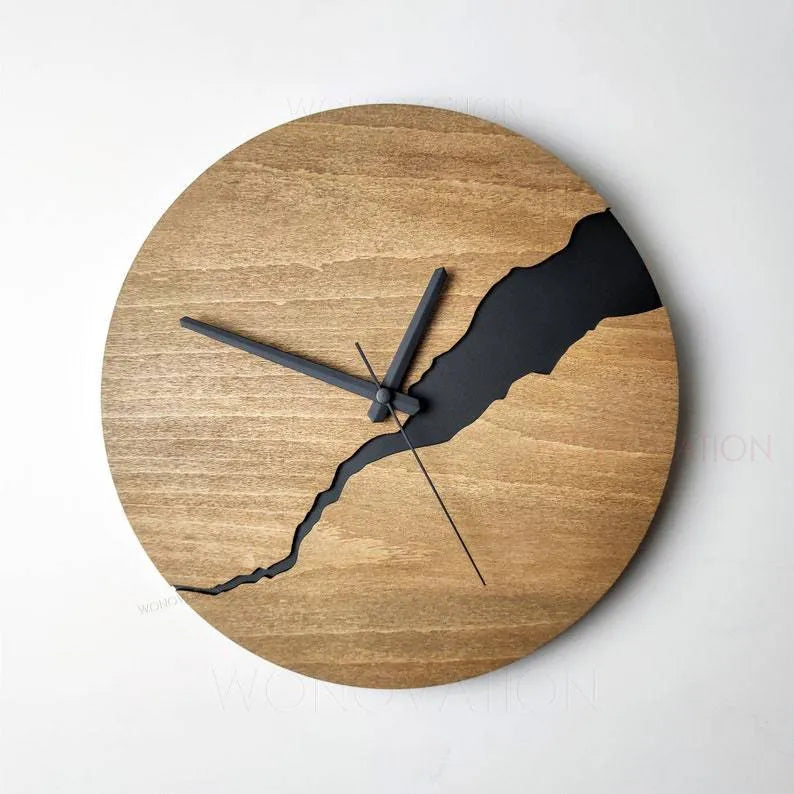 Modern simple wooden wall clock with crack design on a plain wall