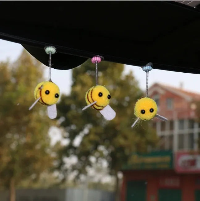 Yellow and black cartoon bee car decoration made from fur ball material measuring 3x3cm