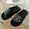 Women's pink cat-themed flip-flop slippers with a thick light blue EVA platform sole.
