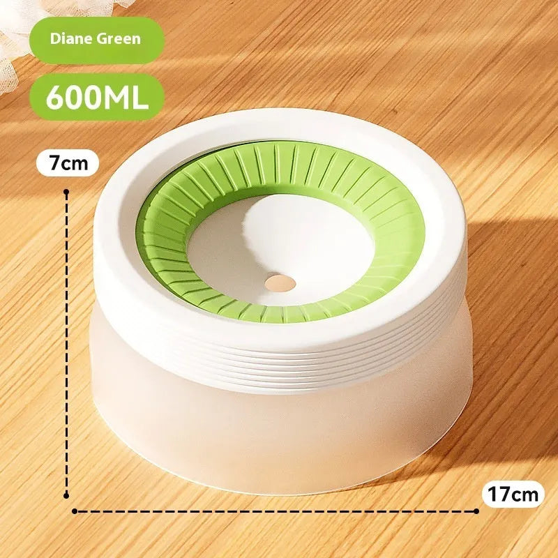 Green suspended pet water bowl for medium and small dogs and cats on a white plate