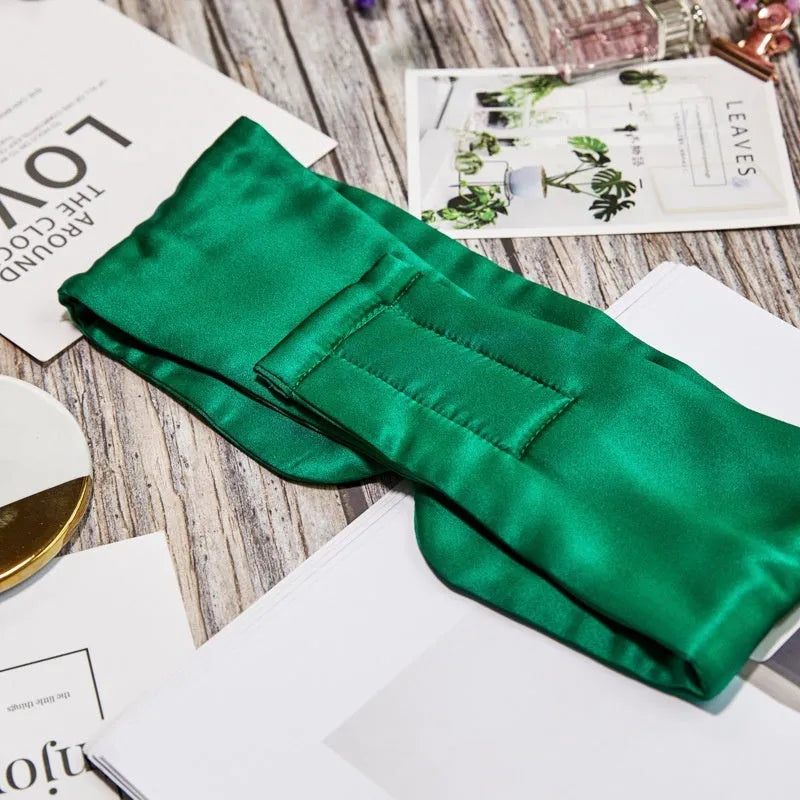 Mulberry silk sleep eye mask in multiple colours including black, gold, green, blue, pink, grey, and white.