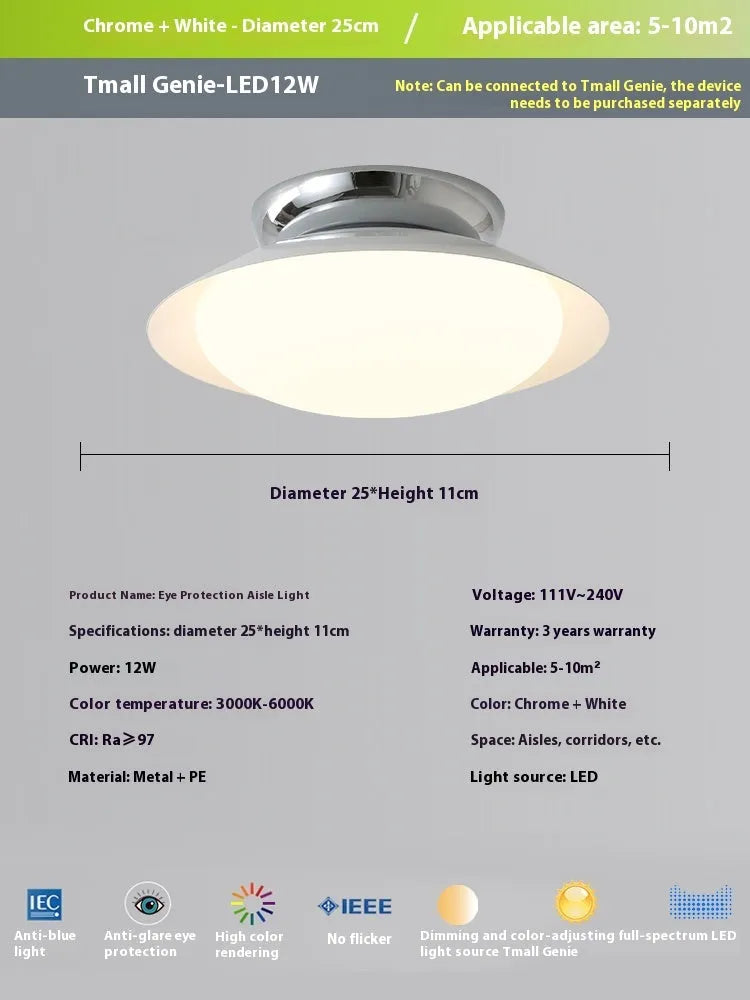 Modern minimalist cream style flying saucer ceiling lamp in mint green on a white ceiling.