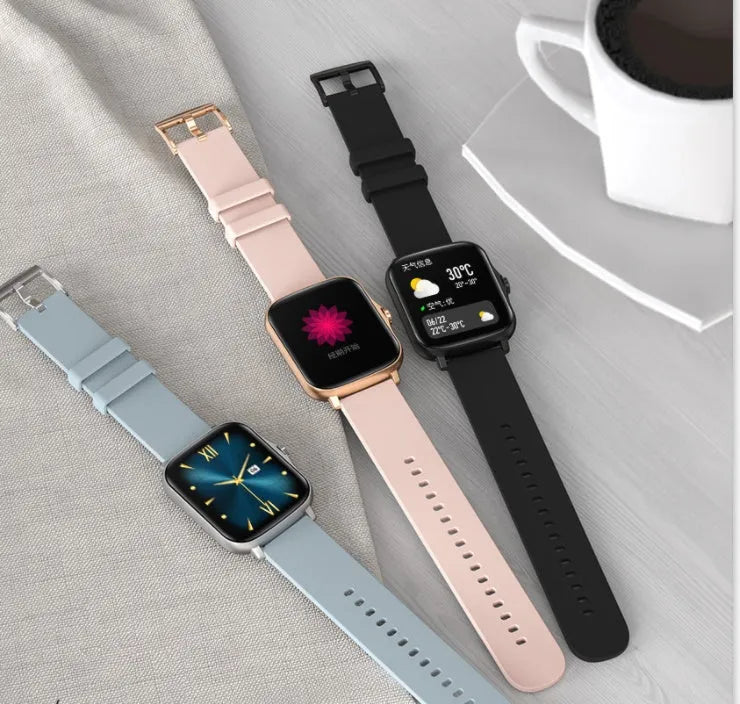 Black smart watch with 1.7-inch colour touch screen and silicone strap on a wrist.