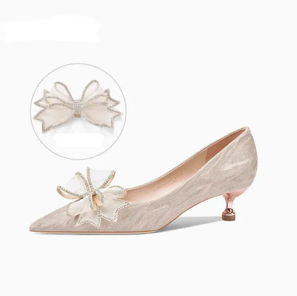 Women's champagne gold sequinned pointed-toe pumps with a stiletto heel on a rubber sole.
