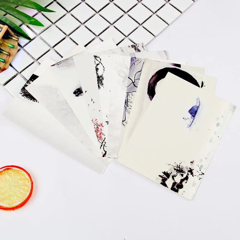 Set of nine Japanese style postcards showing various designs including ink painting and cat illustrations.