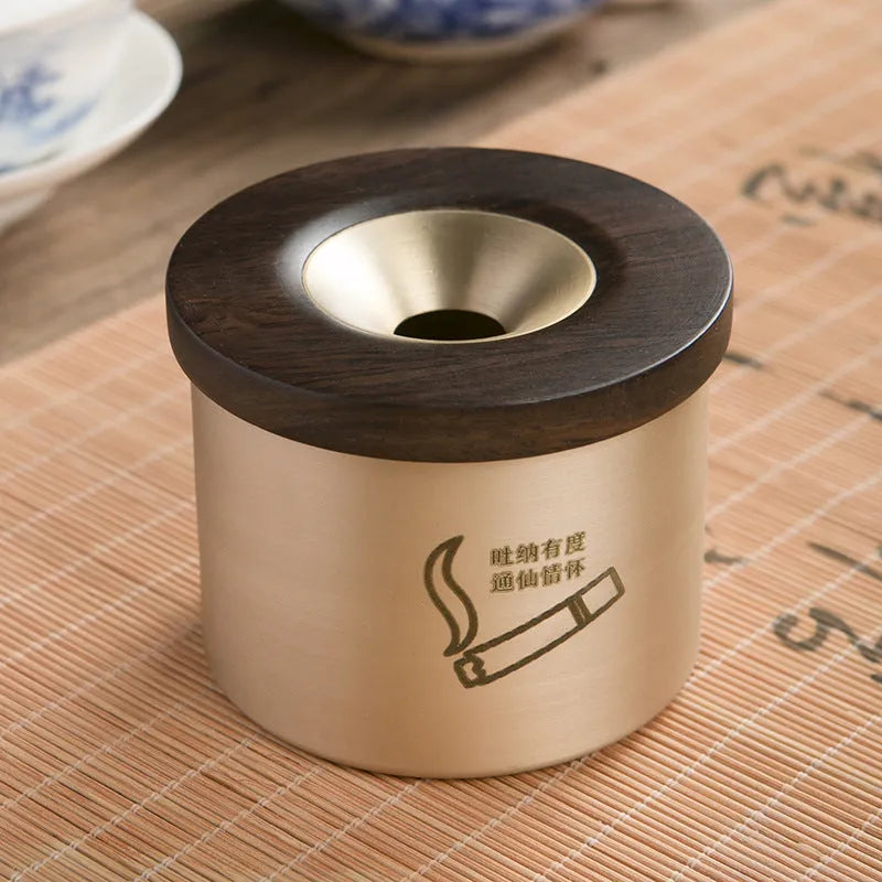 Brass ashtray with wooden lid in retro design for living room decor