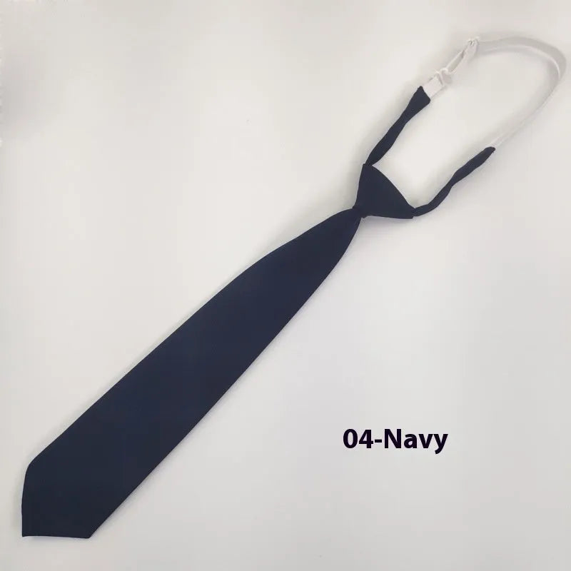 Men's navy blue cotton bow tie with arrow style on a plain background.