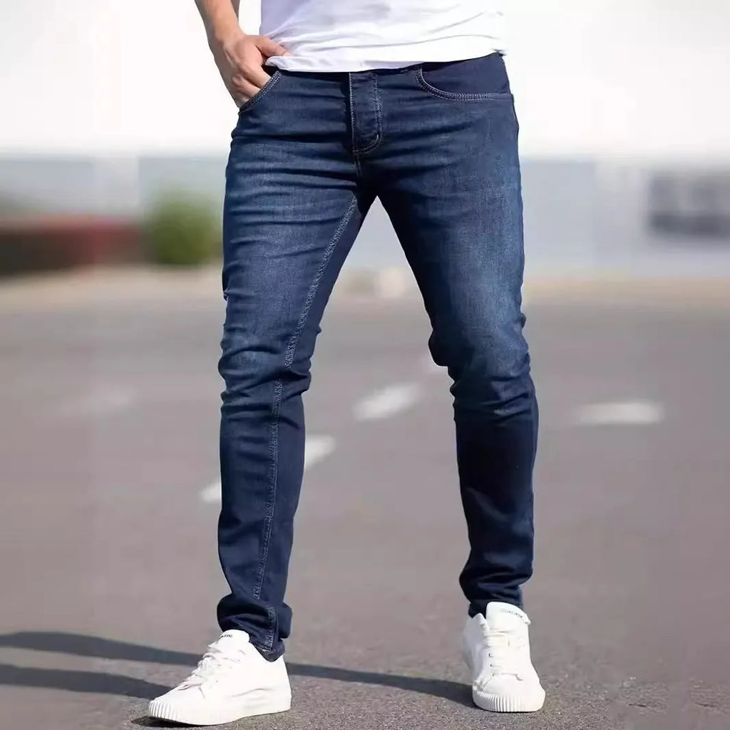 Men's dark blue slim fit cotton jeans with skinny style and mid-waist design